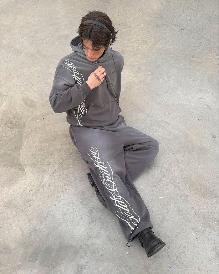 SCRIPT HOODIE ANTRACITE GREY - grey script print hoodie, street style shot - Cold Culture