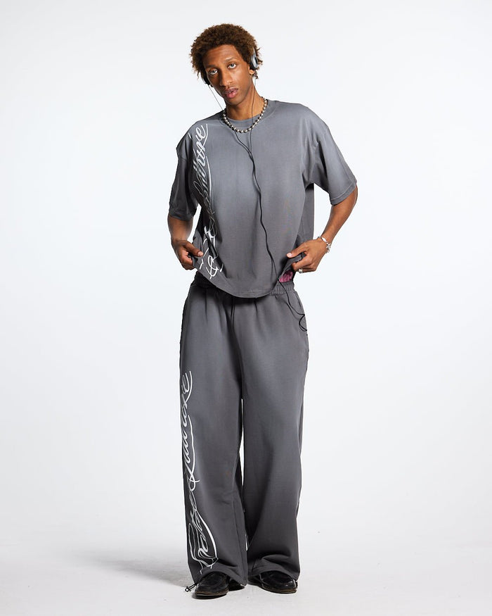 SCRIPT SWEATPANTS ANTRACITE GREY - dark grey script print sweatpants, front view on male model - Cold Culture #man