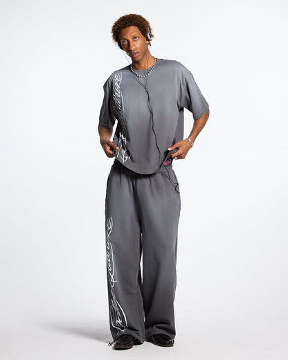 SCRIPT SWEATPANTS ANTRACITE GREY - dark grey script print sweatpants, front view on male model - Cold Culture #man