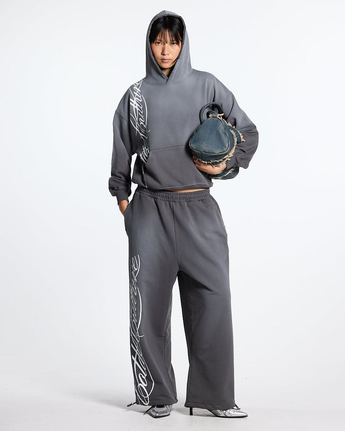 SCRIPT SWEATPANTS ANTRACITE GREY - dark grey script print sweatpants, front view on female model - Cold Culture #woman