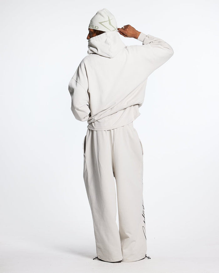 SCRIPT SWEATPANTS LIGHT GREY - light grey script print sweatpants, back view on male model - Cold Culture #man