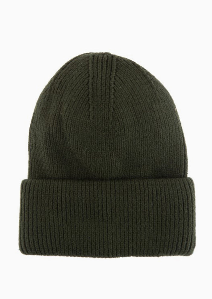A knit beanie with oversized cuff in willow green.