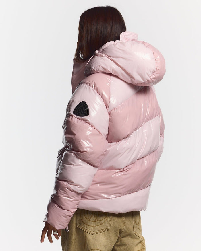 SPIRAL PUFFER GLOSSY PINK MIX - pink striped puffer jacket, back view on female model - Cold Culture #woman