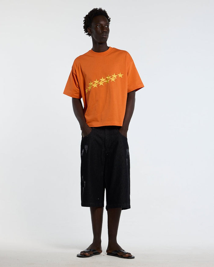 STARS TEE VIBRANT ORANGE - orange star print tee, front view on male model - Cold Culture