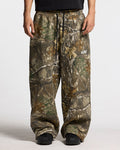 SWEATPANTS REALTREE EDGE - brown camo sweatpants, front view on male model - Cold Culture #man